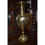 A vintage brass Eastern style vase, height approx. 60cm