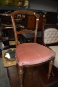 A Victorian Aesthetic salon or dining chair with later pink dralon upholstery
