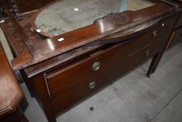 An early 20th Century mahogany chest of drawers, with rail and mirror to convert back to dressing