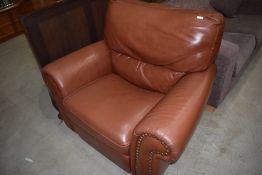 A modern leather manual recliner armchair