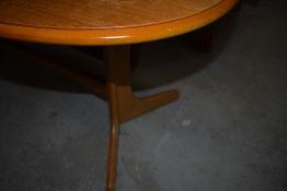 A 20th Century oval coffee table on whale tail type legs, width approx. 106cm