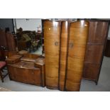 A mid 20th Century walnut ply wardrobe and dressing table