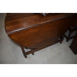 An early 20th Century oak twist gateleg dining table