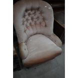 A Victorian mahogany frame nursing chair having button back and pink dralon upholstery
