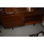 A vintage sapele sideboard (office or living) having tambour doors, width approx 153cm