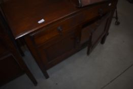 An early 20th Century bathroom or similar cabinet having long drawer and double cupboard under,
