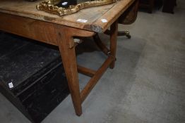 A traditional sycamore and ash side table in a rustic condition, width approx. 124cm