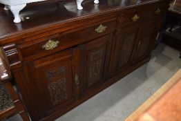 A Victorian mahogany double width sideboard having ledge back, width approx. 191cm