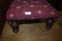 A reproduction footstool in the Flemish style