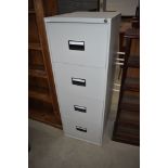 A modern metal four drawer filing cabinet