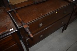 An early 20th Century oak chest of drawers, with rails to convert back to dressing table if required