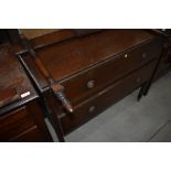 An early 20th Century oak chest of drawers, with rails to convert back to dressing table if required