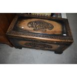 A traditional Oriental carved camphor wood bedding or similar chest, width approx. 90cm