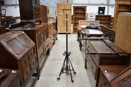 A Victorian wrought iron lamp stand , with copper embellishments