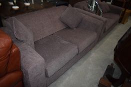 A pair of modern settees, in neutral brown fabric, with matching scatter cushions, possibly a Next