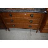 A late Victorian oak washstand having marble top and Arts and Crafts style handles, width approx.