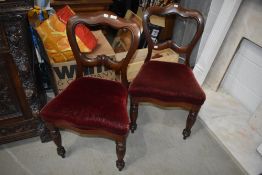 A pair of Victorian mahogany balloon back dining chairs