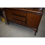 An early 20th Century mahogany sideboard having ledge back and cabriole legs, width approx. 150cm