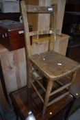 A traditional childs kitchen or school chair, having double stretchers