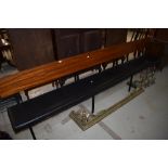 A vintage pew having wood frame and book rail to rear, with vinyl seat, length approx. 300cm