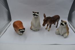 Three Lomonosov studies, Racoons, along with a Beswick study, Donkey 2267A