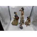 Four Nao Figurines, Boy with Puppy. Girl holding Bird, Girl in Wind and Girl with Flowers (af)
