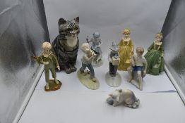 A selection of decorative Studies and Figurines, a Winstanley Cat, Metzler & Ortloff Children at