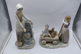 A Lladro study, The Cart, Girl with Cart holding boy and dog, model no 1245 and a Nao study, Girl