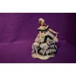 A German reproduction decorative figurine, Crinoline Lady with Dog and Parosol