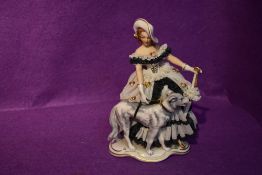 A German reproduction decorative figurine, Crinoline Lady with Dog and Parosol