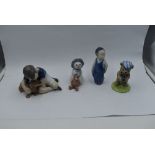 Three Royal Copenhagen figures, Boy with Dog 1502, Boy 3250 and Snow Baby with Teddy Bear 019