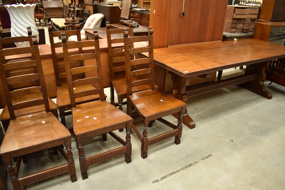 A top quality oak refectory style dining table and set of six ladder back chairs in the period