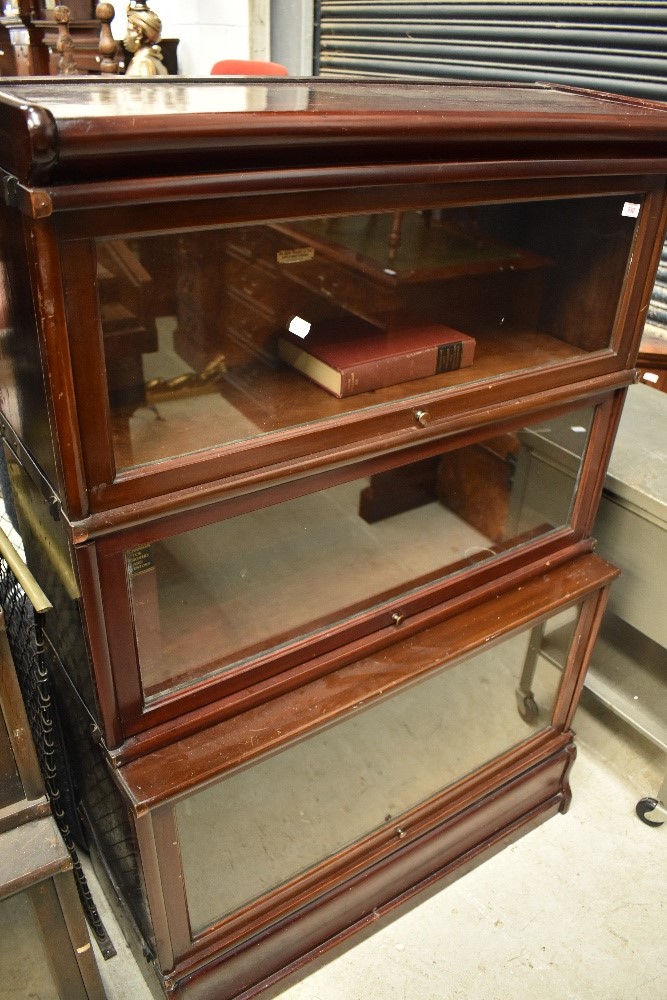 An early 20th Century mahogany stacking bookcase unit , having three glazed tiers, unlabelled but in