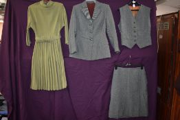A ladies vintage 1940s green three piece suit and a 1950s green pleated dress with high neckline and