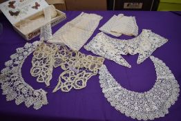 A selection of antique lace,tulle and more collars, panels and similar.