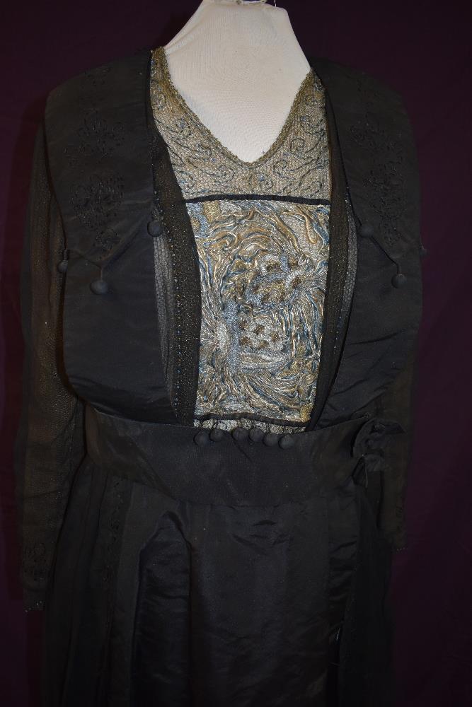 An early 20th century black taffeta tea dress having panels of georgette to sides with st - Image 2 of 10