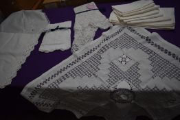 A selection of vintage and antique table cloths and napkins and good sized lengths of edging