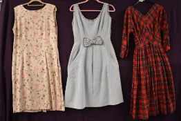 Three vintage dresses, late 40s/50s red tartan dress,and two late 50s/early 60s dresses.