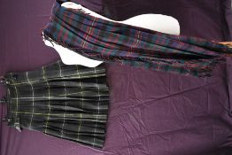 A vintage kilt and similar, around 1940s,some wear.