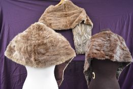 Three vintage light brown fur wraps or stoles, one with pockets.