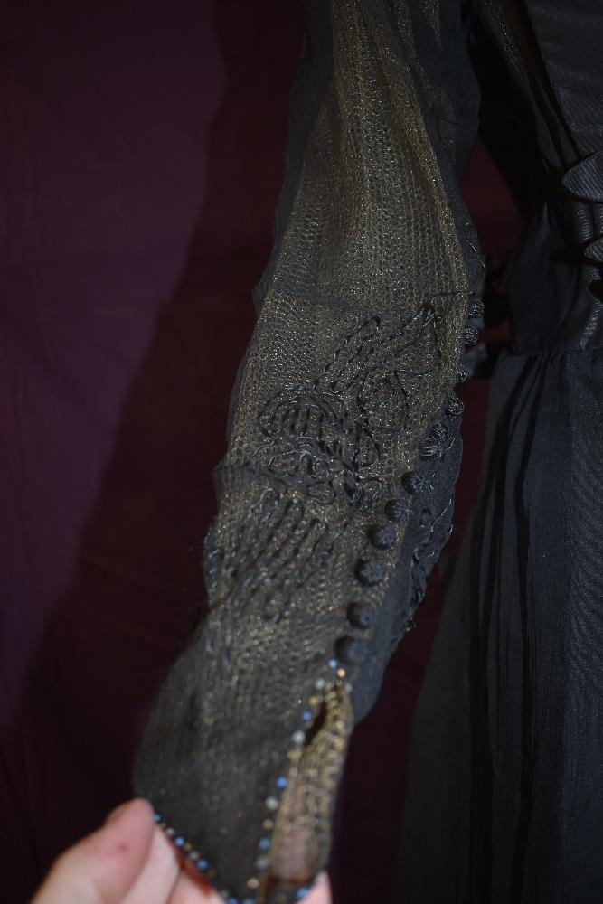 An early 20th century black taffeta tea dress having panels of georgette to sides with st - Image 8 of 10