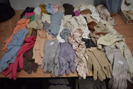 A huge collection of mixed vintage and antique gloves, various fabrics, styles and sizes.