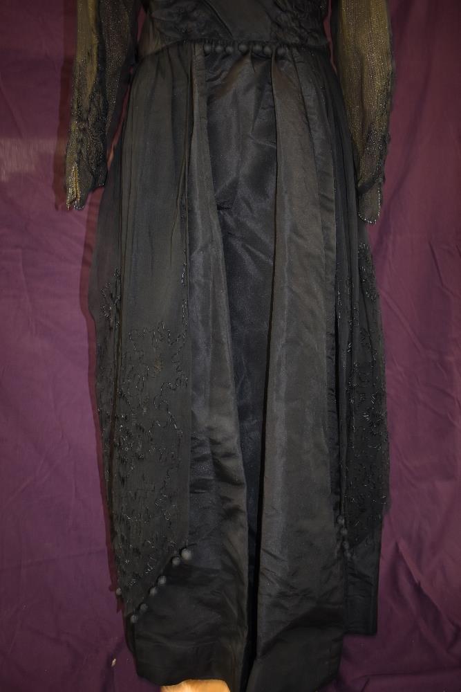 An early 20th century black taffeta tea dress having panels of georgette to sides with st - Image 7 of 10