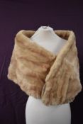 Two vintage mink wraps one mahogany brown and a blonde mink wrap which has a pinkish tinge running