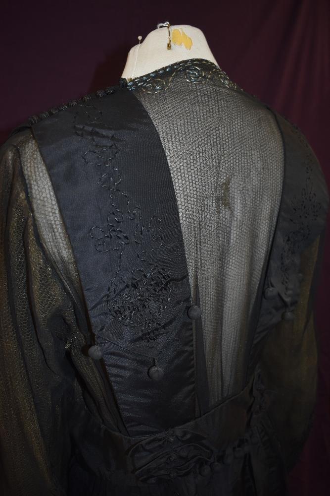 An early 20th century black taffeta tea dress having panels of georgette to sides with st - Image 9 of 10