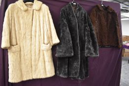 Three vintage coats including grey faux fur, brown astrakhan and blonde mink with half belt to