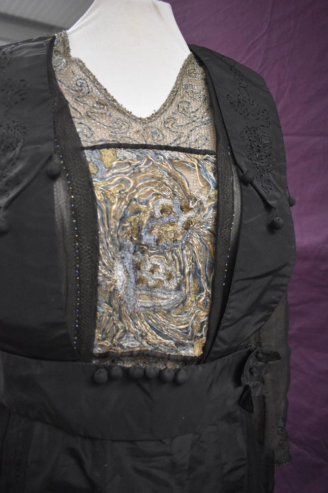 An early 20th century black taffeta tea dress having panels of georgette to sides with st - Image 4 of 10