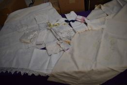 A selection of vintage and antique table cloths including damask tray cloth and good sized lengths