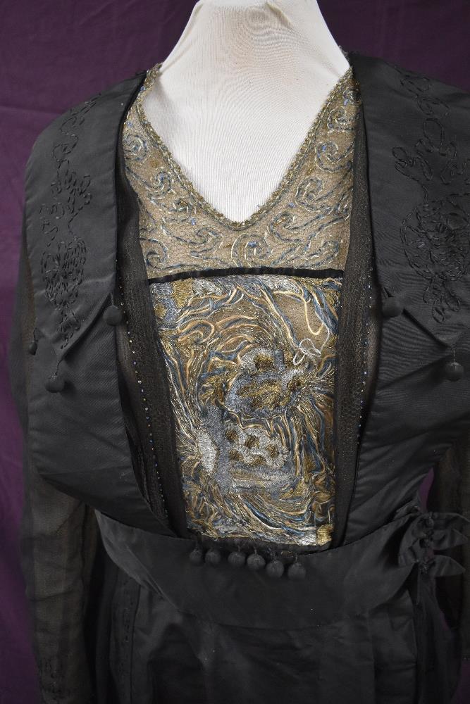 An early 20th century black taffeta tea dress having panels of georgette to sides with st - Image 10 of 10