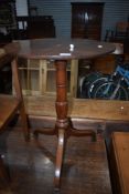 A 19th Century occasional tripod table having circular top , turned column and splay legs with spade